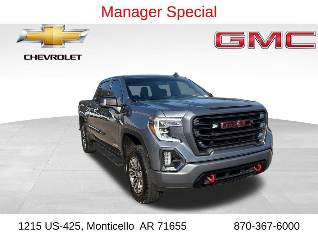 2021 GMC Sierra 1500 AT4 in Satin Steel Metallic — front three-quarter view